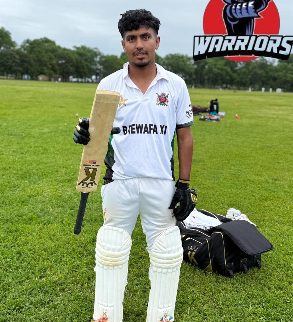 Cricketer holding a bat on a cricket field with 'Warriors' logo in the background